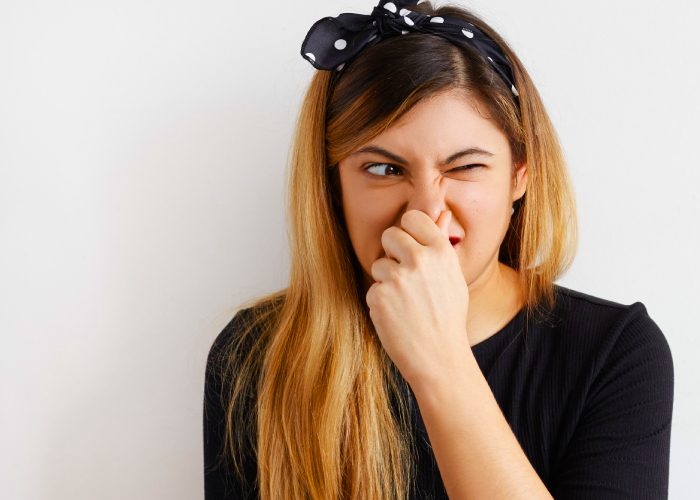 Woman covering her nose