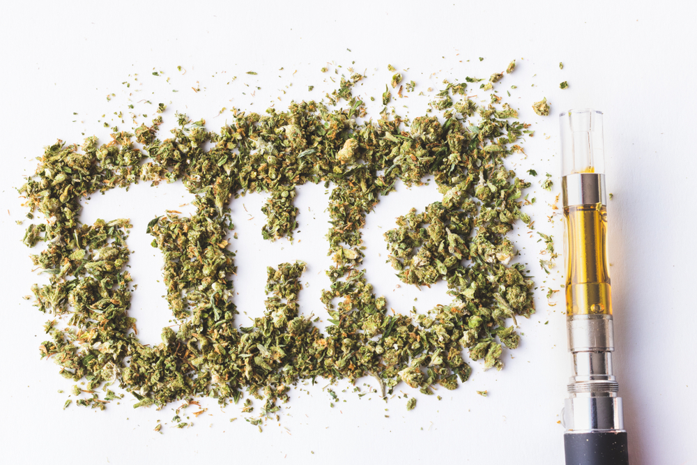 THC letter surrounded by marijuana leaves and a vaping pen